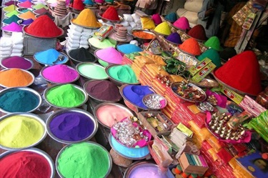 A market stall selling neat piles of colourful powder